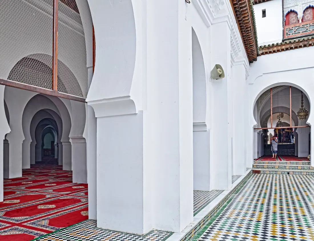 Arches and zellige tiles in a courtyard in Fès
